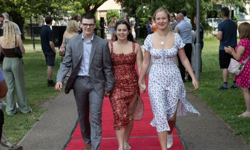 Image of students arriving at the event along the red carpet in 2023