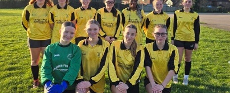 Image of our Our Under 18 girls football team posed for the camera