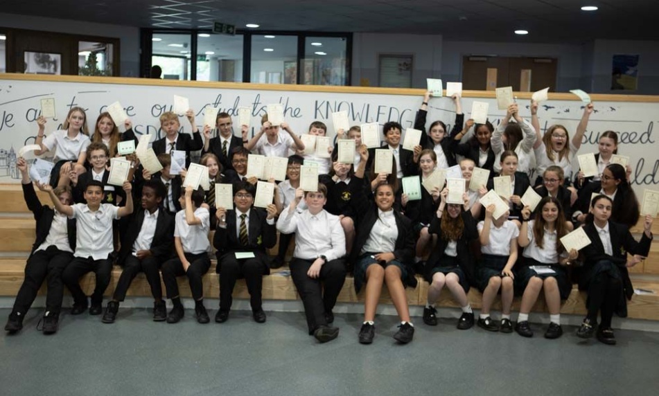 Image of dane Court Grammar School prize winners students with their certificates