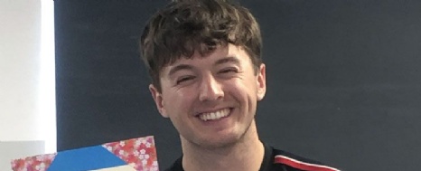 Image of an event participant with their Japanese calligraphy